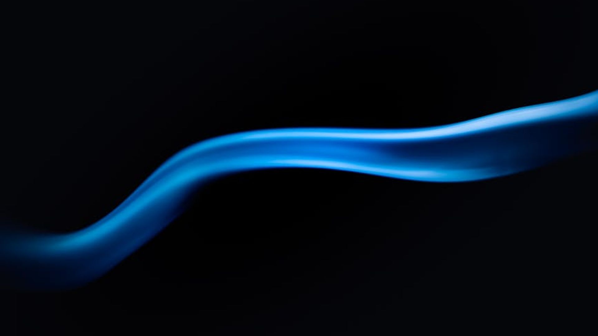 Abstract representation of fluid motion with light blue lines on a black background.