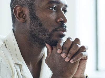 Close-up of a person's hands in a calm, meditative pose.